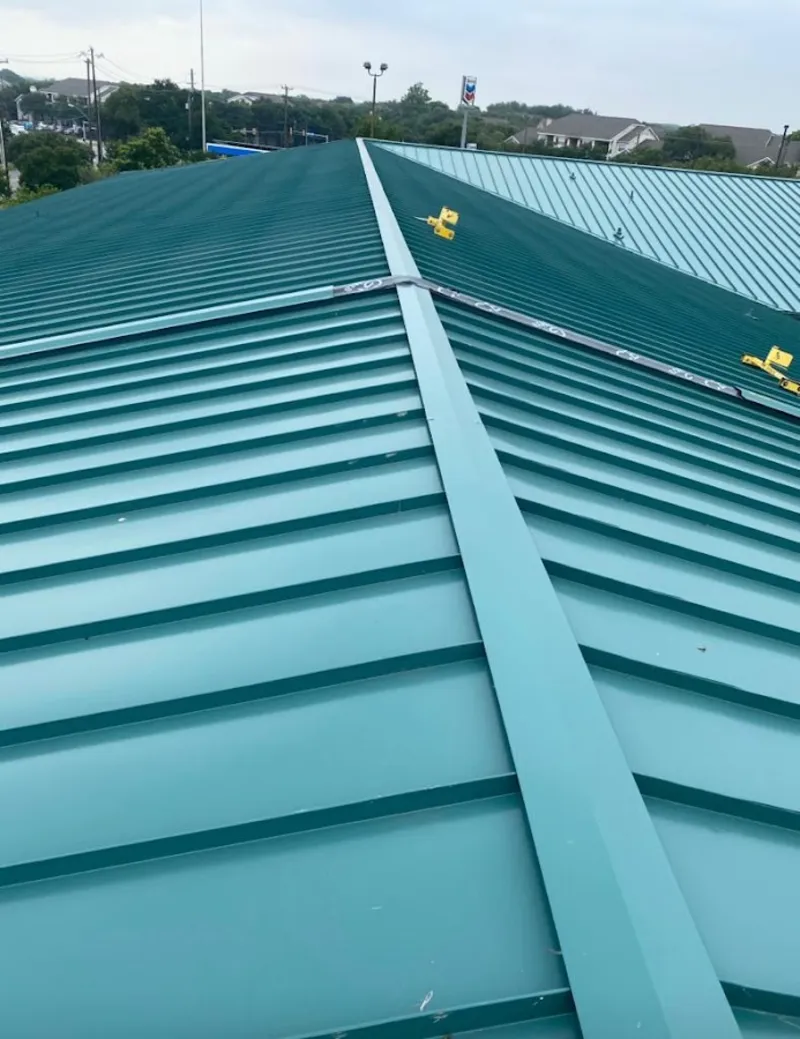 Green commercial metal roof ridge and valley for Metal Roof Repair in Parma Heights